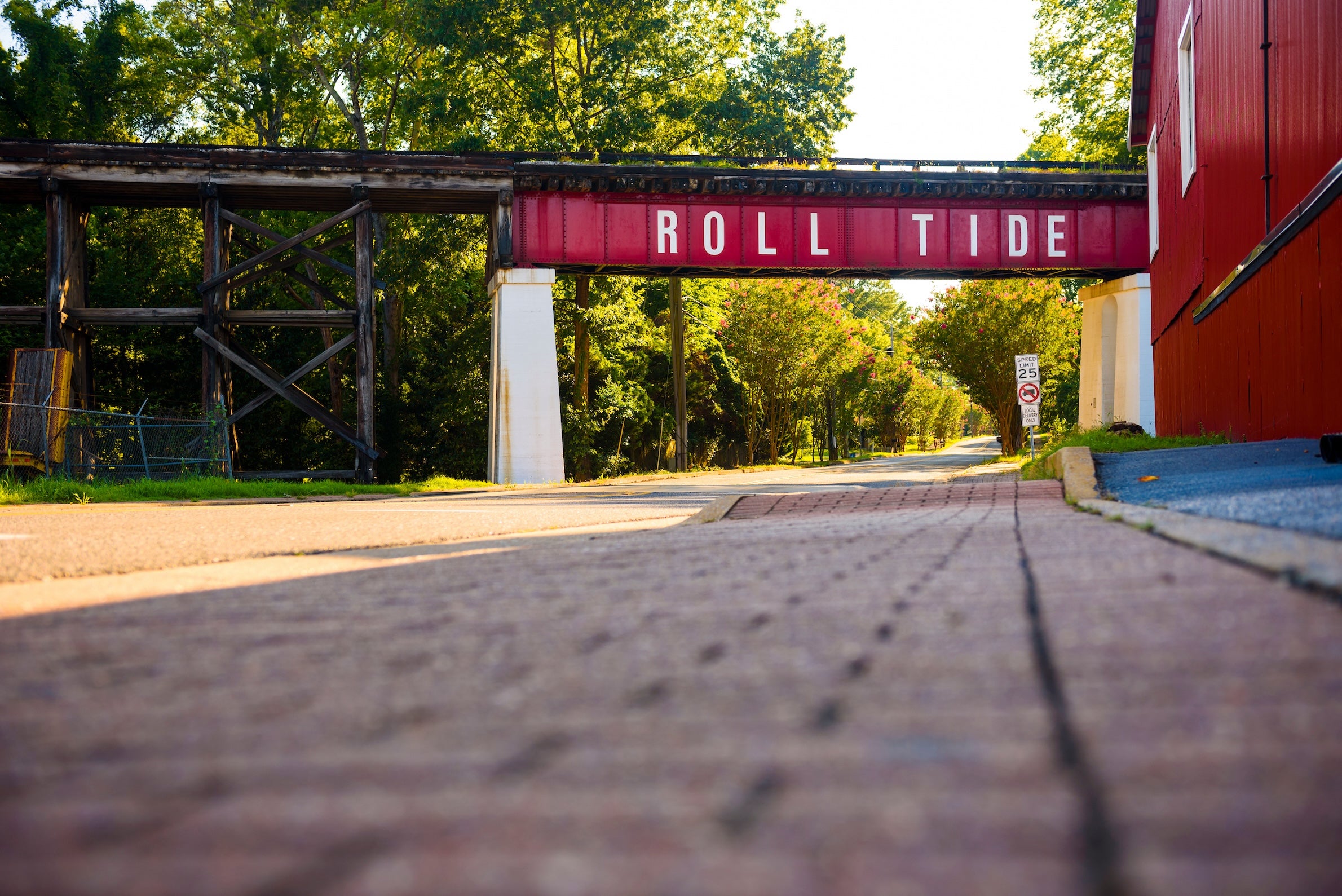 Picture of red bridge with "Roll Tide" on its side.