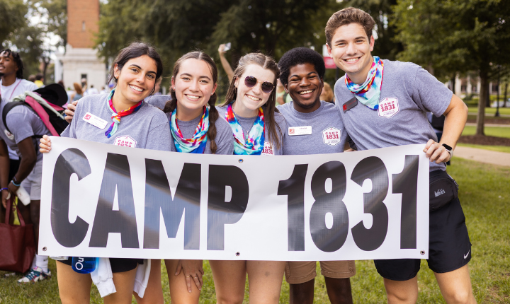 Students holding banner that reads Camp 1831. 
