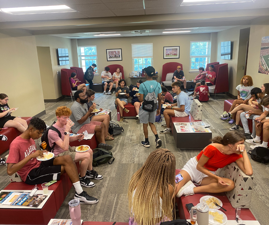 Students eating at an event.