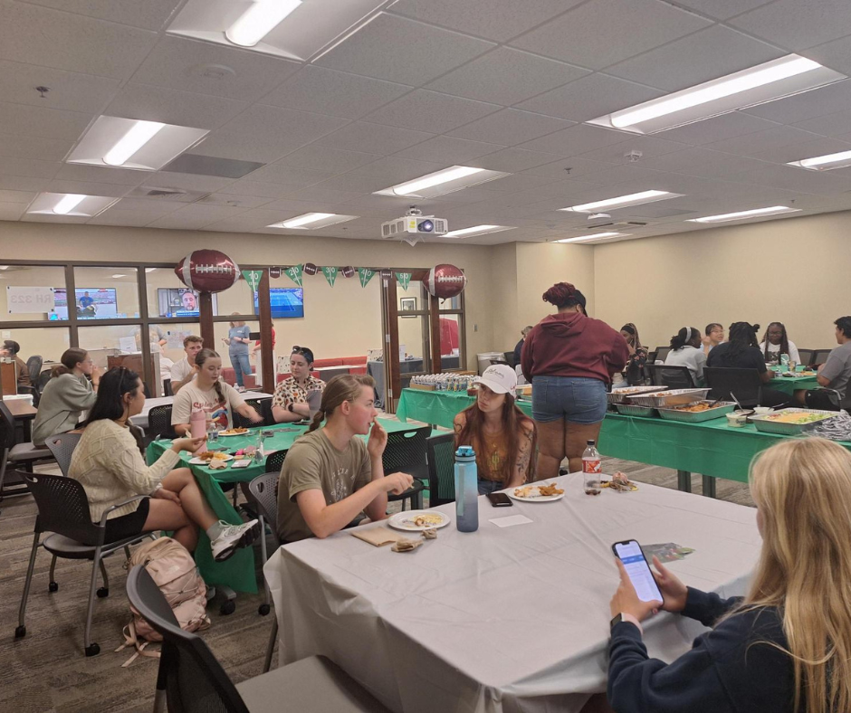 Students eating together at First Gen Friday event. 