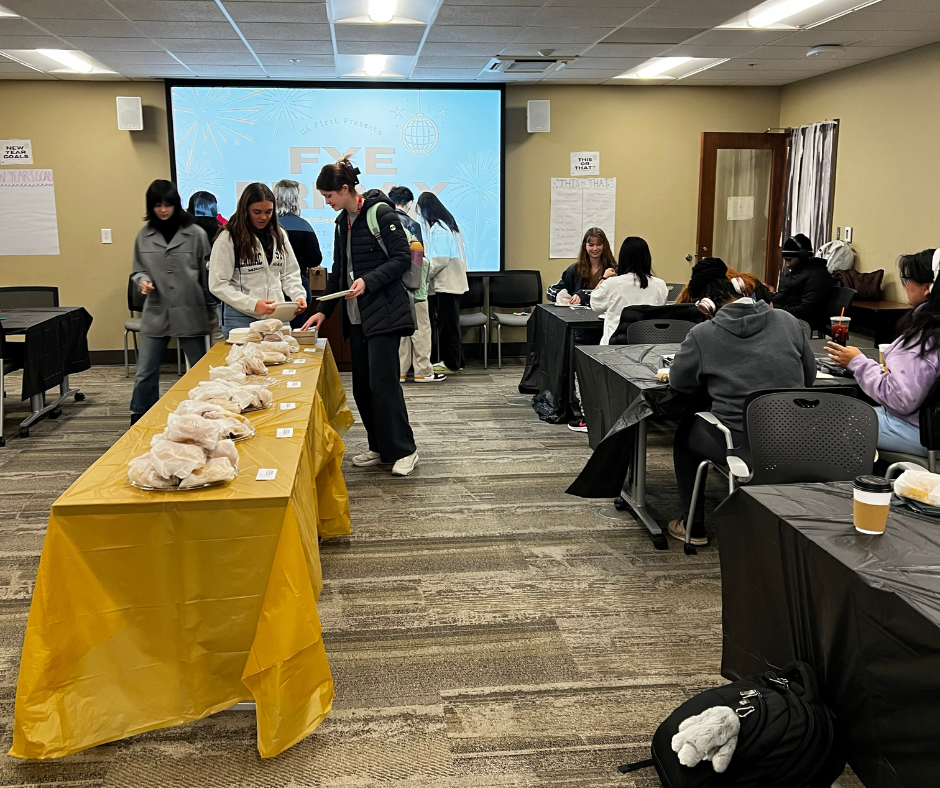 Students eating together at a FYE Friday event